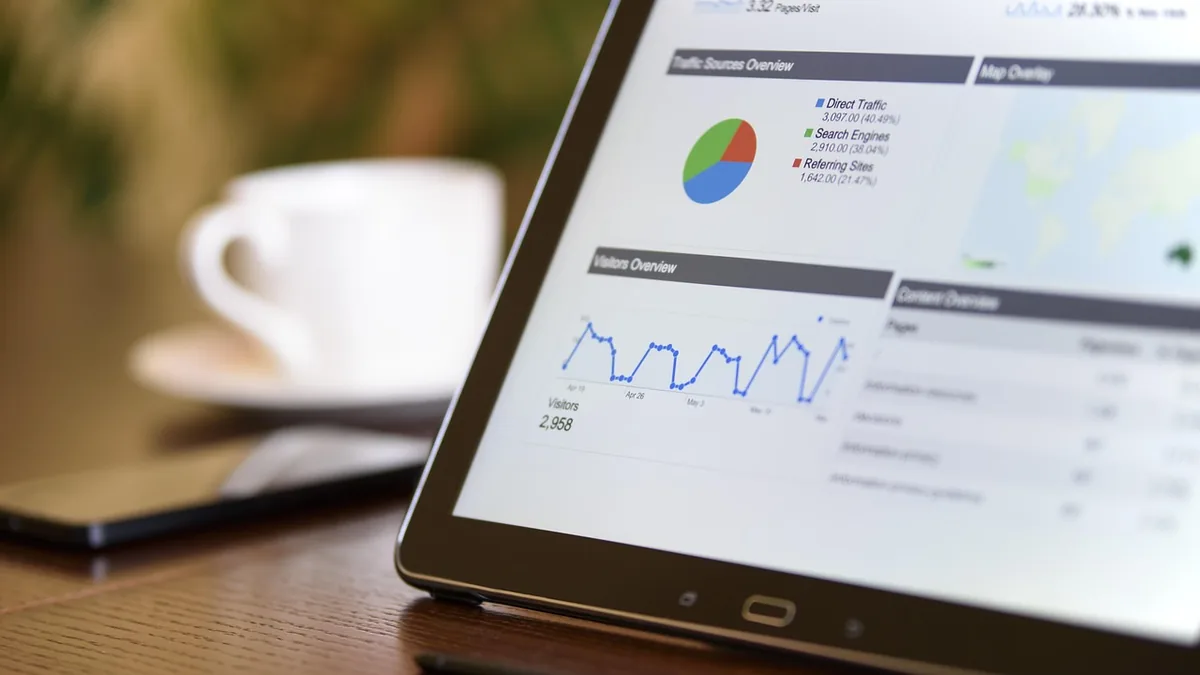A marketer reviewing campaign results on a laptop