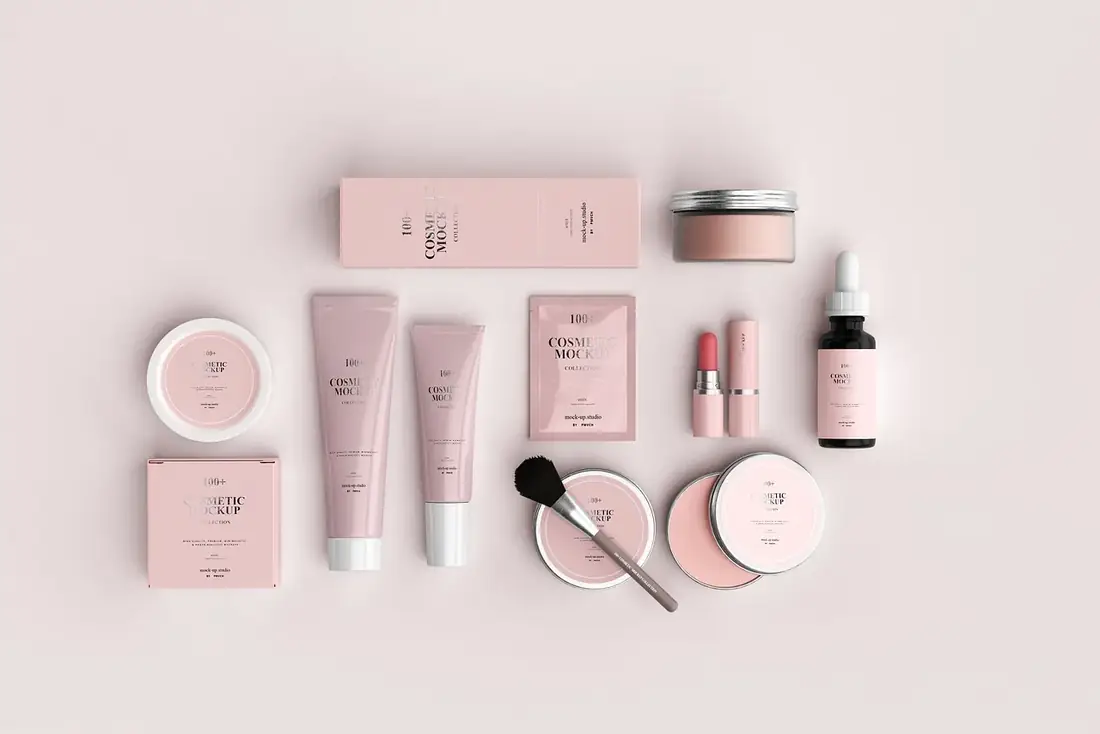 Skincare products arranged on a pink background