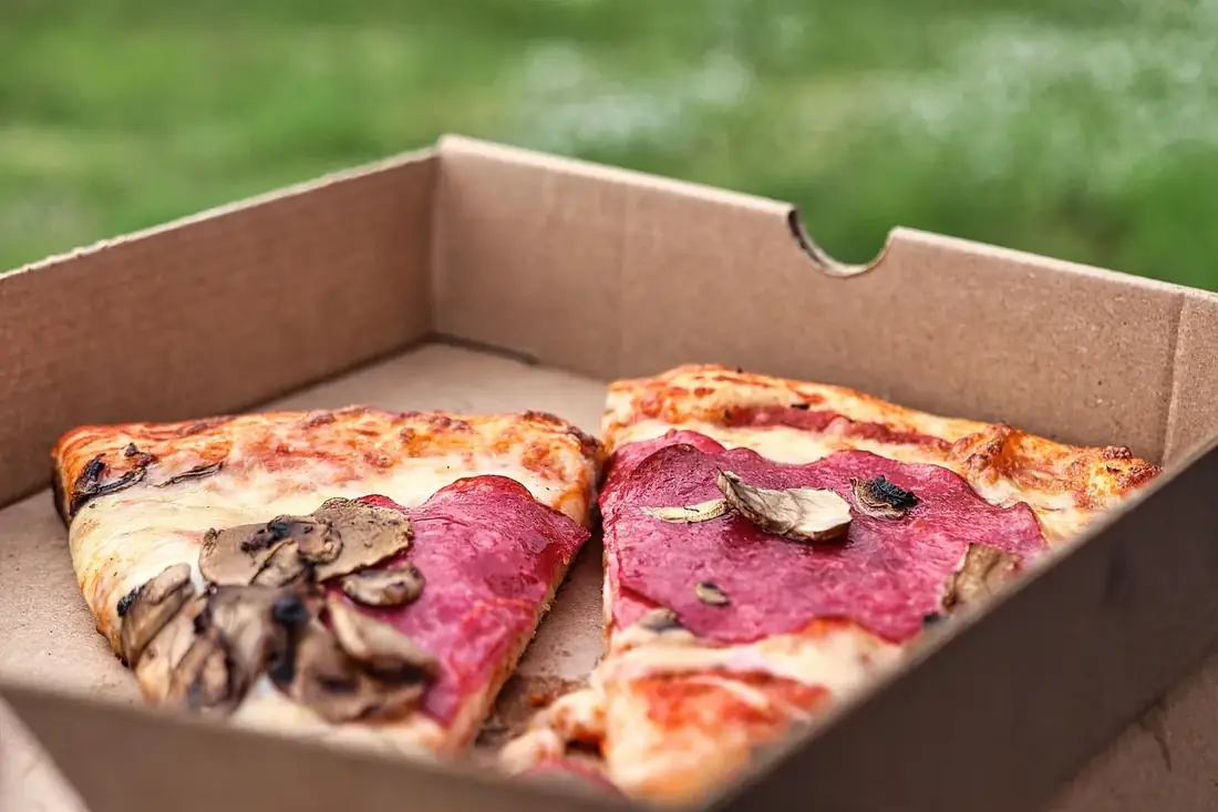 Pizza slices in a cardboard box