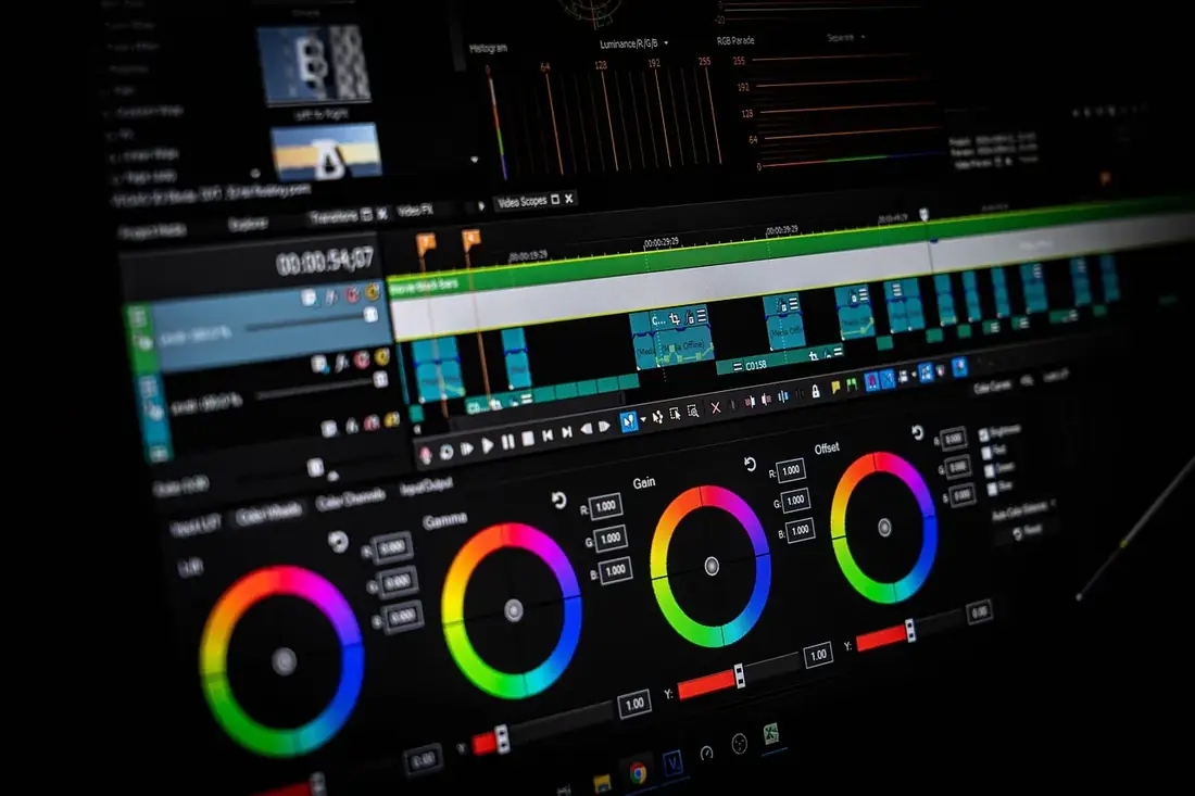 A video editing timeline with color wheels