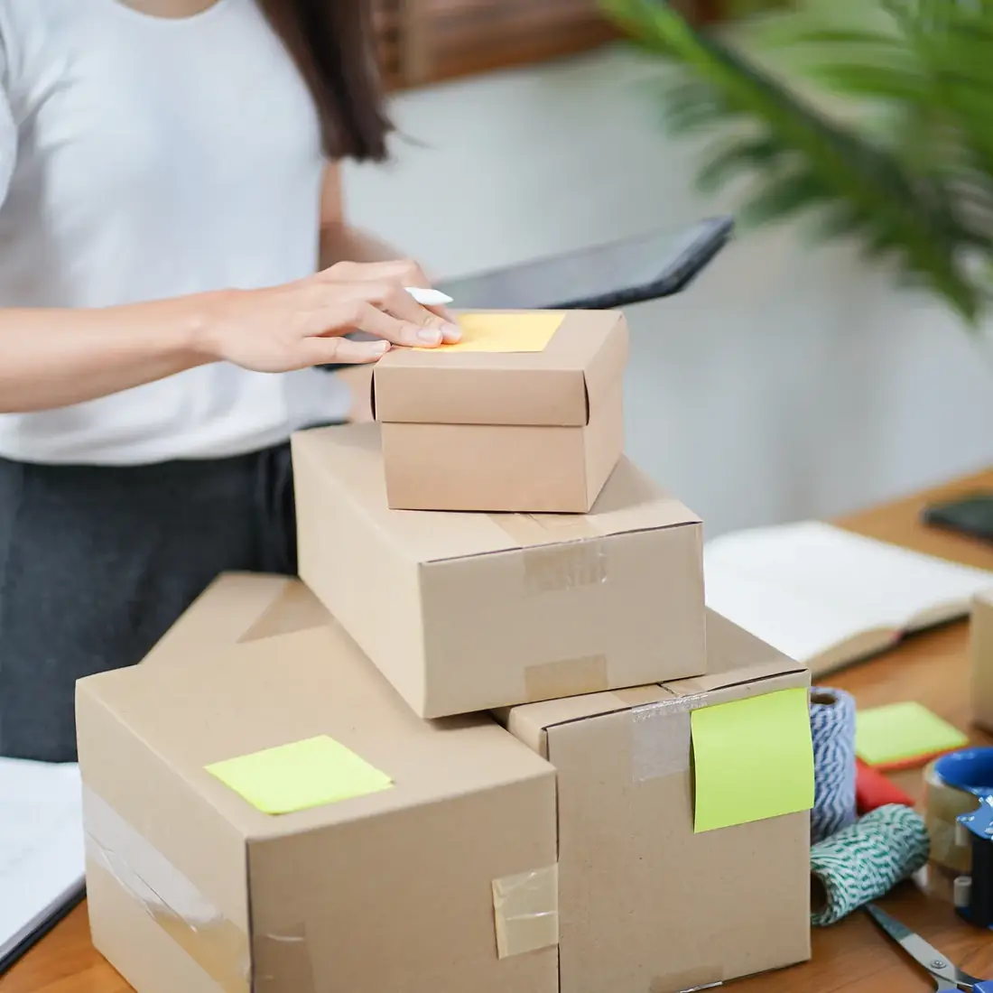 Packed boxes and a laptop on a desk