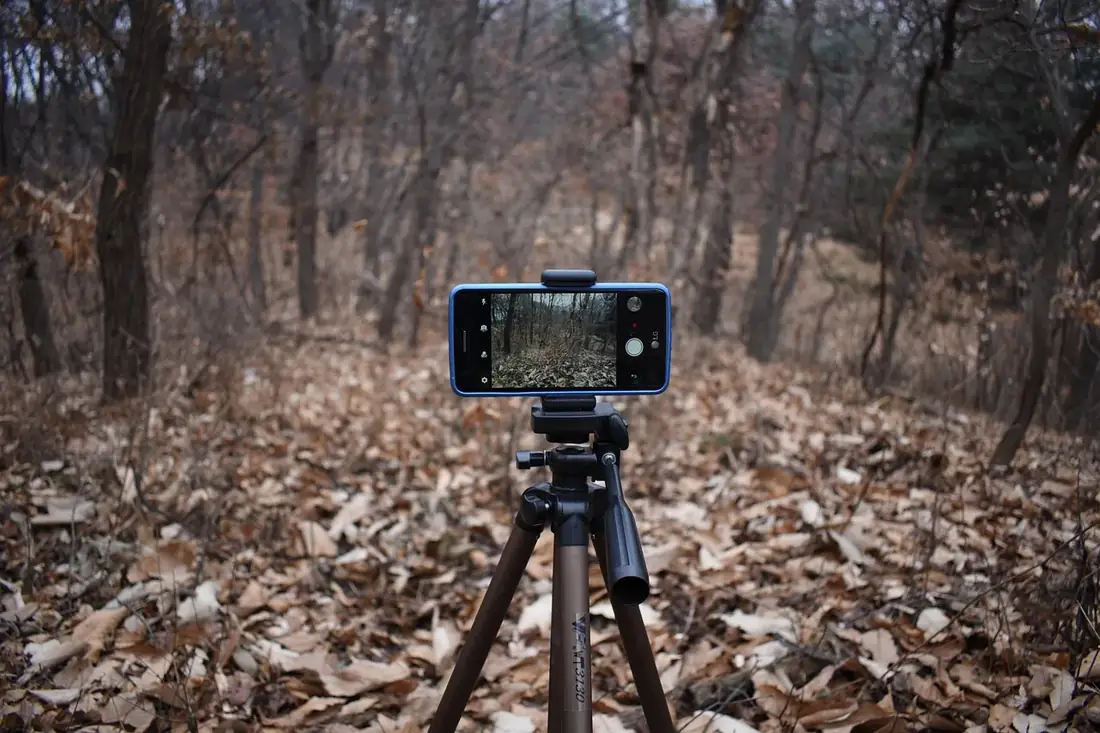 A phone on a tripod ready to record a video ad